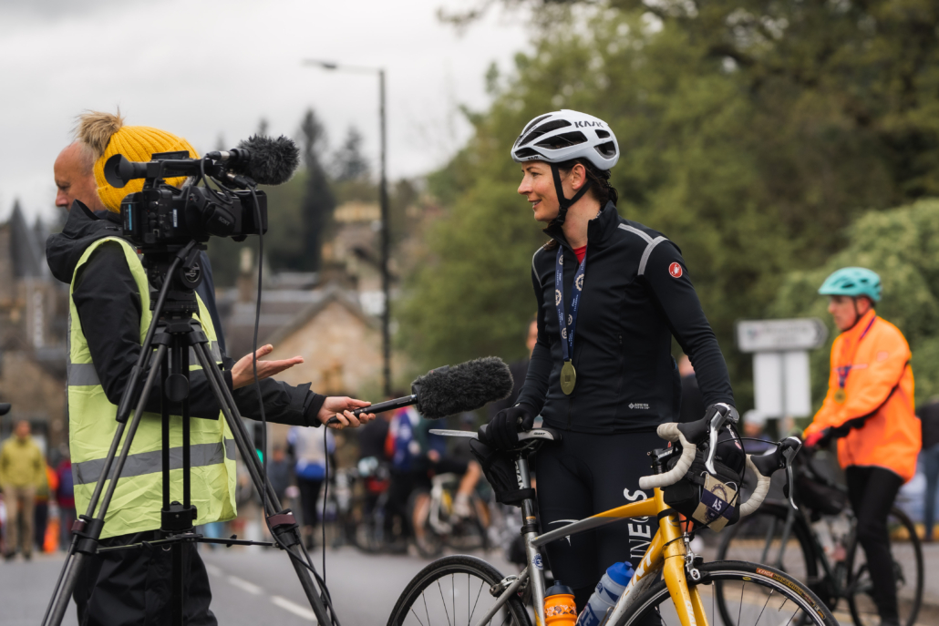 Public Relations Agency, Perth, Scotland - Cunningly Good Group - Picture of the media interviewing Gold Medal Olympian Eve Muirhead at the Etape Caledonia event in Pitlochry