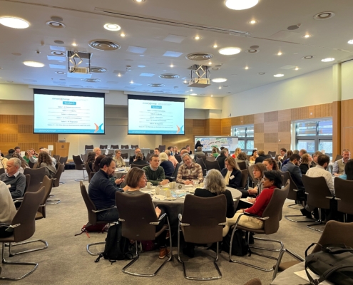 Public Relations Agency Perth, Scotland - Cunningly Good Group - Image of a presenter at the Climate Xchange conference in Edinburgh - Climate Horizon 2040