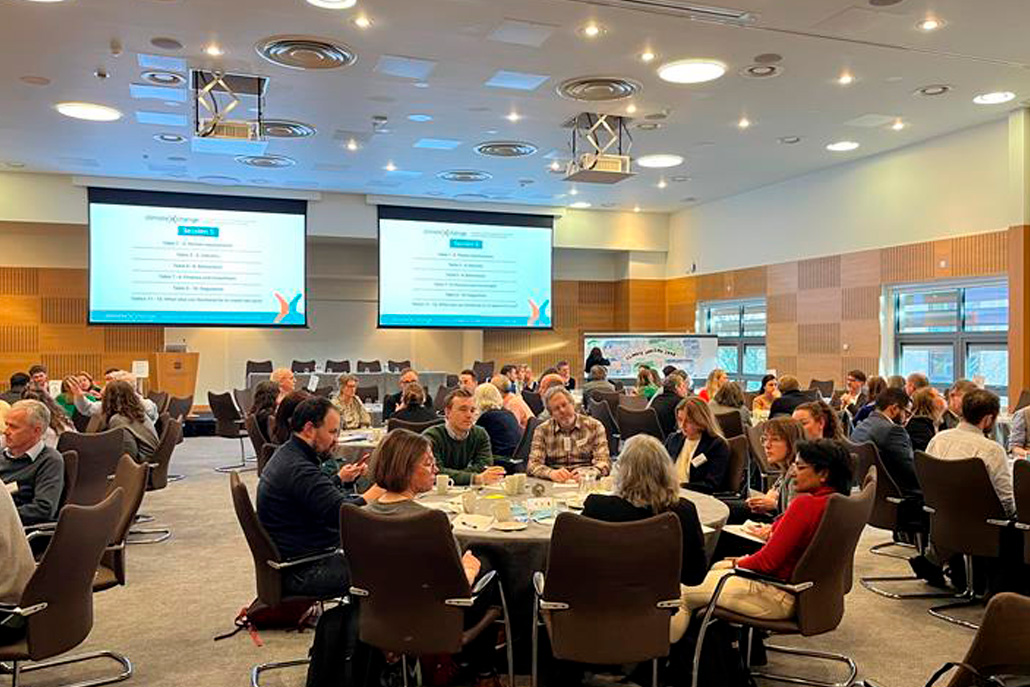 Climate change conference organised by Cunningly Good Group with attendees listening to presentations.