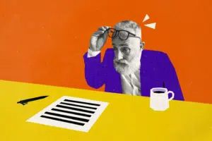 Cunningly Good Group Marketing Agency Perth, Scotland – visual of an illustrated man while reviewing a document at a desk with a pen and coffee mug.