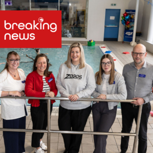 Xcite and Zoggs representatives at a West Lothian swimming pool promoting a new children's swim kit initiative.